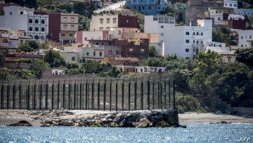 A picture taken on September 4, 2018 shows a view of a section of the border fence encircling Spain's North African enclave of Ceuta which lies on the Strait of Gibraltar, surrounded by Morocco. (Photo by FADEL SENNA / AFP)