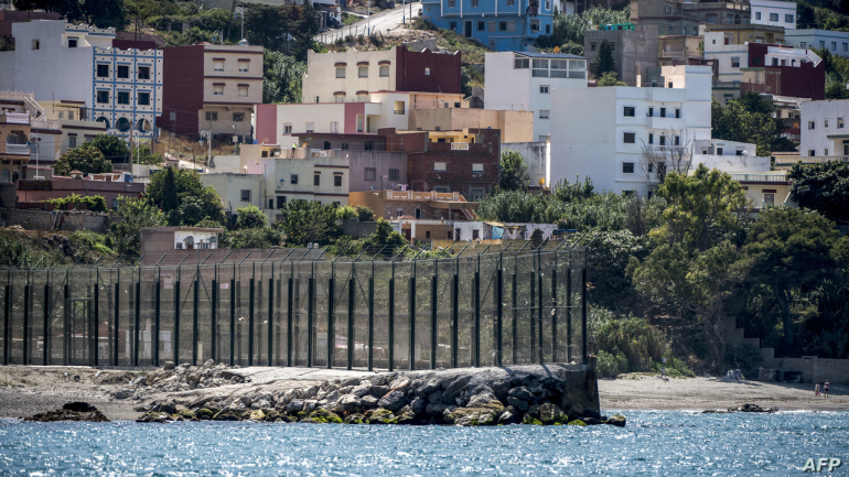 A picture taken on September 4, 2018 shows a view of a section of the border fence encircling Spain's North African enclave of Ceuta which lies on the Strait of Gibraltar, surrounded by Morocco. (Photo by FADEL SENNA / AFP)