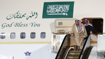 Saudi Arabia's King Salman (front) disembarks from a plane upon his arrival at Vnukovo airport outside Moscow, Russia October 4, 2017. REUTERS/Sergei Karpukhin