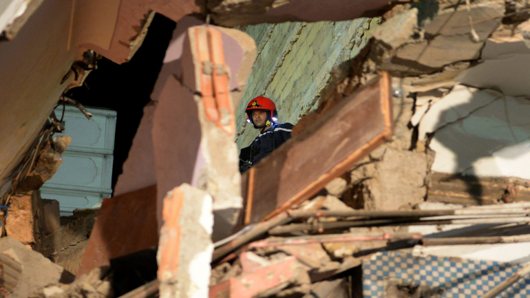A member of the rescue teams searches for people trapped under the rubble after a four-storey building collapsed in Casablanca on August 5, 2016. Witnesses said the building that collapsed in the Sbata district of Morocco's economic capital had a cafe on the ground floor that had been teeming with clients at the time of the accident. / AFP / FADEL SENNA (Photo credit should read FADEL SENNA/AFP via Getty Images)