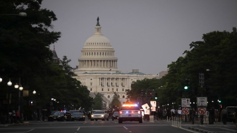 WASHINGTON, USA - MAY 29: Police vehicles are seen as hundreds of demonstrators rally hours after the arrest of a white police officer involved in the death of a black man George Floyd in the state of Minnesota on May 29, 2020 in Washington D.C. United States. Floyd, 46, a black man, was arrested Monday after reportedly attempting to use a counterfeit $20 bill at a local store. Video footage on Facebook showed him handcuffed and cooperating. But police claimed he resisted arrest. A white officer kneeled on his neck, despite Floyd’s repeated pleas of "I can't breathe." Former police officer Derek Chauvin was charged with third-degree murder and manslaughter, according to Hennepin County Prosecutor Michael Freeman. Minneapolis, Minnesota Mayor Jacob Frey said Friday he imposed a mandatory curfew because of ongoing protests regarding the death of George Floyd. Protestors made their way to the White House where they faced a police response with some clashing with the secret service members. ( Yasin Öztürk - Anadolu Agency )