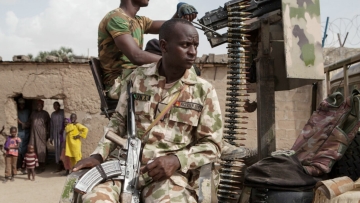 Nigerian soldiers patrol in the town of Banki in northeastern Nigeria on April 26, 2017. Banki has been totally destroyed during battles between the Nigerian army and Boko Haram insurgents. Over 32,000 people live in the town but free movement is limited. / AFP PHOTO / FLORIAN PLAUCHEUR (Photo credit should read FLORIAN PLAUCHEUR/AFP/Getty Images)