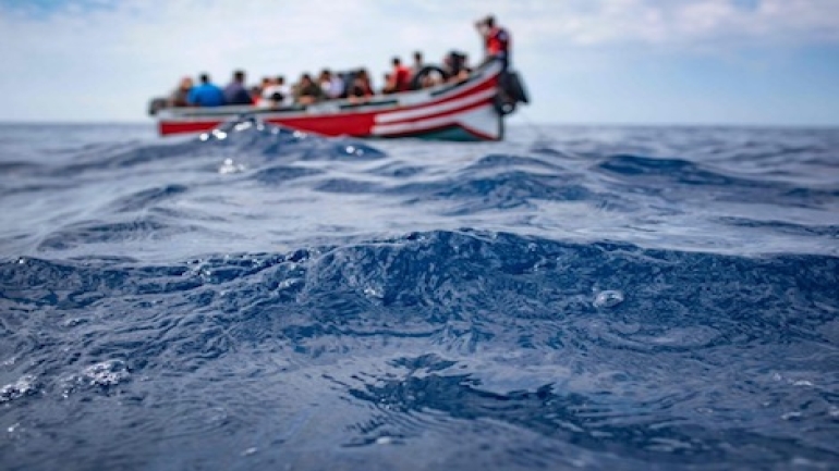 TOPSHOT - A boat carrying 157 migrants is stranded in the Strait of Gibraltar before being rescued by the Spanish Guardia Civil and the Salvamento Maritimo sea search and rescue agency on September 8, 2018. - While the overall number of migrants reaching Europe by sea is down from a peak in 2015, Spain has seen a steady increase in arrivals this year and has overtaken Italy as the preferred destination for people desperate to reach the continent. Over 33,000 migrants have arrived in Spain by sea and land so far this year, and 329 have died in the attempt, according to the International Organization for Migration. (Photo by Marcos Moreno / AFP)