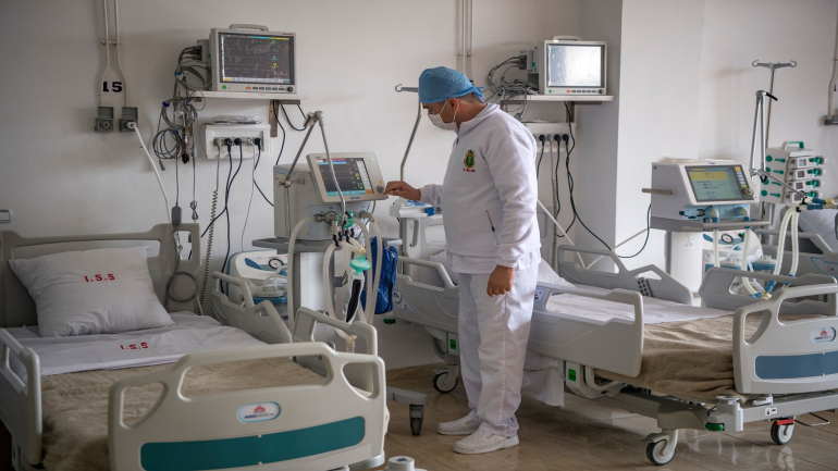A member of the medical staff at Moroccos's military field hospital in the region of Benslimane checks a monitor as he remains on stand-by amid the novel coronavirus pandemic crisis, on April 17, 2020. (Photo by FADEL SENNA / AFP) (Photo by FADEL SENNA/AFP via Getty Images)