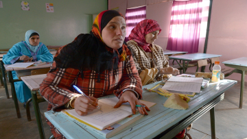 Moroccan women learn how to read, write and calculate during a lesson in the village of Timoulilt, in Azilal Province of the Tadla-Azilal region of Morocco, on January 27, 2014. AFP PHOTO/FADEL SENNA (Photo credit should read FADEL SENNA/AFP/Getty Images)