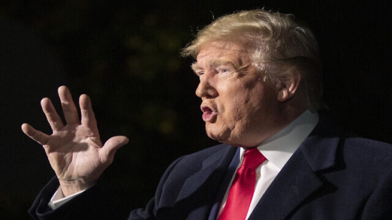 President Donald Trump speaks to reporters as he leaves the White House in Washington for a trip to New York City, Saturday, Nov. 2, 2019. (AP Photo/Manuel Balce Ceneta)