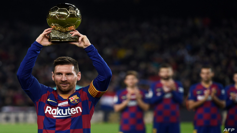Barcelona's Argentine forward Lionel Messi poses with his sixth Ballon d'Or before the Spanish League football match between FC Barcelona and RCD Mallorca at the Camp Nou stadium in Barcelona on December 7, 2019. (Photo by Josep LAGO / AFP)
