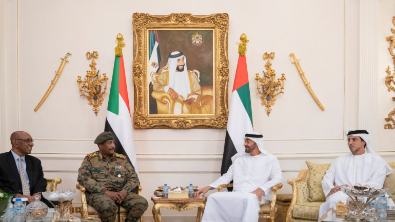 ABU DHABI, UNITED ARAB EMIRATES - May 26, 2019: HH Sheikh Mohamed bin Zayed Al Nahyan, Crown Prince of Abu Dhabi and Deputy Supreme Commander of the UAE Armed Forces (2nd R) meets with Lieutenant General Abdel Fattah Al Burhan Abdelrahman, Head of transitional military council of Sudan (2nd L), at the Presidential Airport. Seen with HH Sheikh Mansour bin Zayed Al Nahyan, UAE Deputy Prime Minister and Minister of Presidential Affairs (R). ( Mohamed Al Hammadi / Ministry of Presidential Affairs ) ---