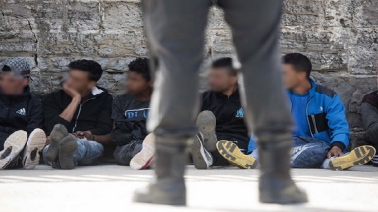 Would-be immigrants sit and rest in the port of Tarifa following their rescue by salvage vessels off the Strait of Gibraltar coast, on June 23, 2017.
Eighty-eight Moroccans have been rescued today in the waters off the Strait of Gibraltar, 16 by the Salvamar Arcturus (based in Tarifa) and 72 by the Salvamar Guardamar C. Arenal (based in Tenerife). Twenty were minors. / AFP PHOTO / Marcos Moreno