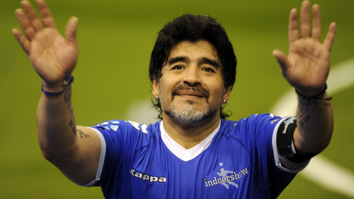 BUENOS AIRES, ARGENTINA - OCTOBER 16: Diego Maradona greets the fans during a soccer match between Argentina and Uruguay in tribute to Fernando Caceres, victim of an assault on October 16, 2010 in Buenos Aires, Argentina. Maradona organized this match to help Caceres to continue with his recovery in Cuba. (Photo by Richard Rad/LatinContent/Getty Images)
