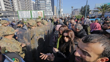 Lebanese anti-government protesters gather in the northern city of Tripoli on January 14, 2020 to denounce the political deadlock and a crippling economic crisis. - Although protests have declined in size, demonstrations have been ongoing since October, increasingly targeting banks and state institutions blamed for driving the country towards collapse. (Photo by Ibrahim CHALHOUB / AFP)
