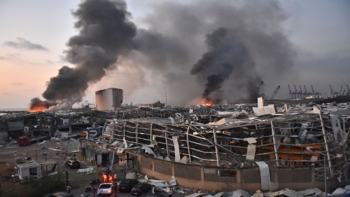 TOPSHOT - EDITORS NOTE: Graphic content / This picture taken on August 4, 2020 shows a general view of the scene of an explosion at the port of Lebanon's capital Beirut. - Two huge explosion rocked the Lebanese capital Beirut, wounding dozens of people, shaking buildings and sending huge plumes of smoke billowing into the sky. Lebanese media carried images of people trapped under rubble, some bloodied, after the massive explosions, the cause of which was not immediately known. (Photo by STR / AFP) (Photo by STR/AFP via Getty Images)