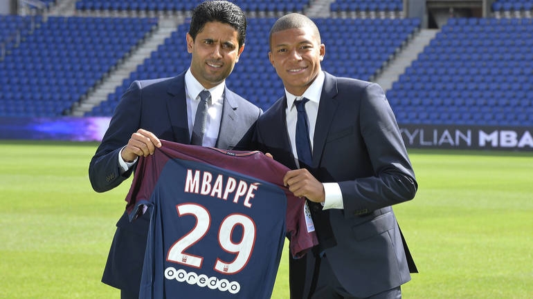 PARIS, FRANCE - SEPTEMBER 06: (L-R) Paris Saint-Germain President Nasser Al Khelaifi poses alongside new signing Kylian Mbappe at the Parc des Princes on September 6, 2017 in Paris, France. Kylian Mbappe signed a five year contract for 180 Million Euro. (Photo by Aurelien Meunier/Getty Images)