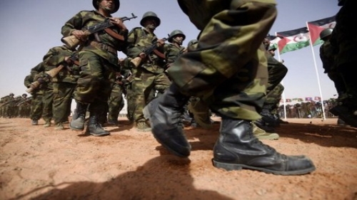 Members of the Sahrawi People's Liberation Army parade during a ceremony to mark 40 years after the Front proclaimed the Sahrawi Arab Democratic Republic (SADR) in the disputed territory of Western Sahara on February 27, 2016 at the Sahrawi refugee camp of Dakhla which lies 170 km to the southeast of the Algerian city of Tindouf. SADR was declared in 1976 by the Polisario Front -- a rebel movement that wants independence for Western Sahara -- which fought a guerrilla war against Rabat's forces before a ceasefire in 1991. / AFP PHOTO / Farouk Batiche